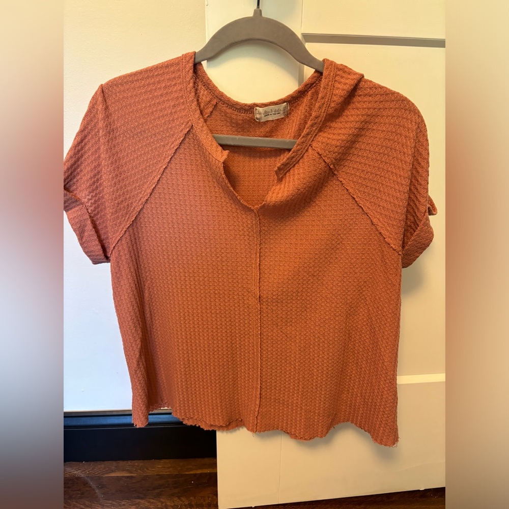 Waffle texture. Really like this shirt! Comfortable and in good condition